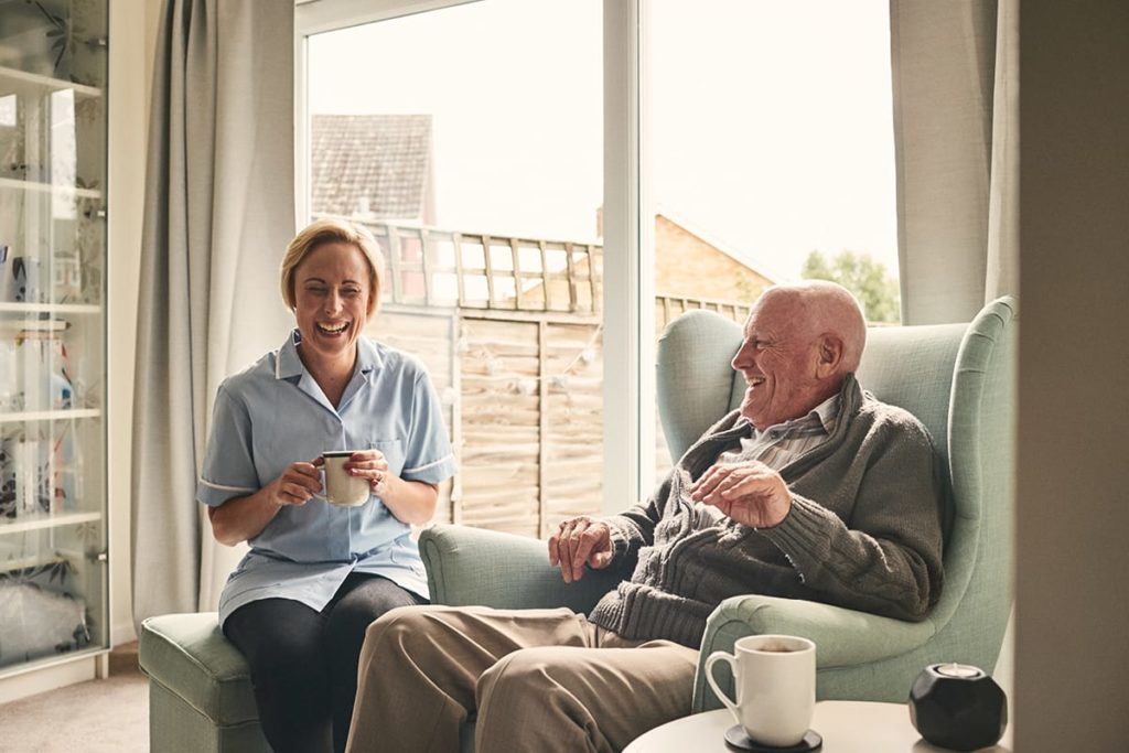 Wiltshire Community Image of care assistant and homeowner enjoying a brew